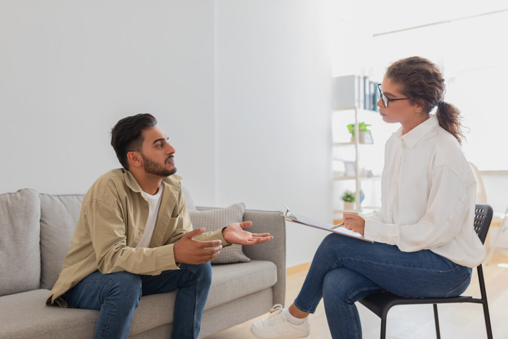 young man talking with therapist in home setting 2026 01 08 23 25 12 utc
